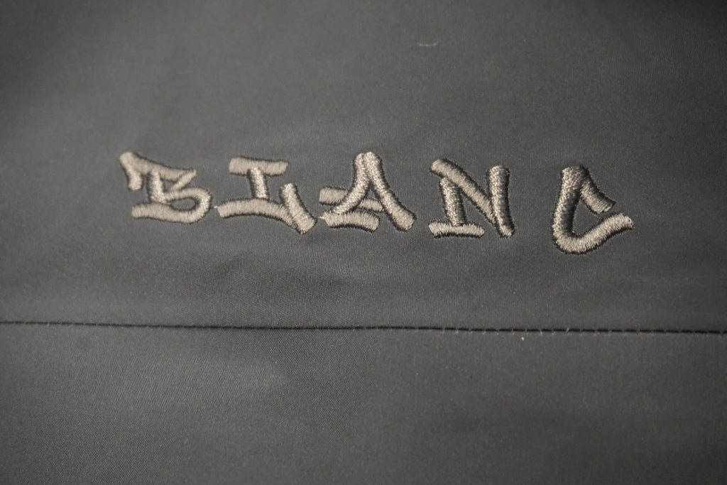 Tone on tone embroidered "BLANC" logo