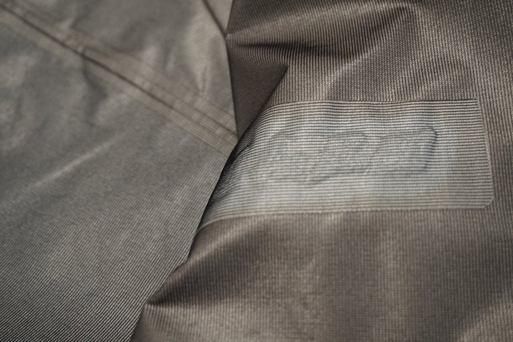 Close-up of the seam taping on a snow shell.